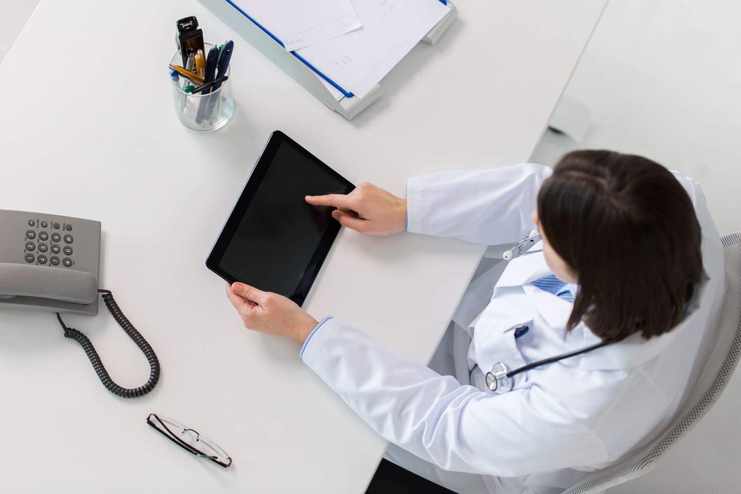 doctor with tablet pc at clinic 2021 08 26 22 49 36 utc