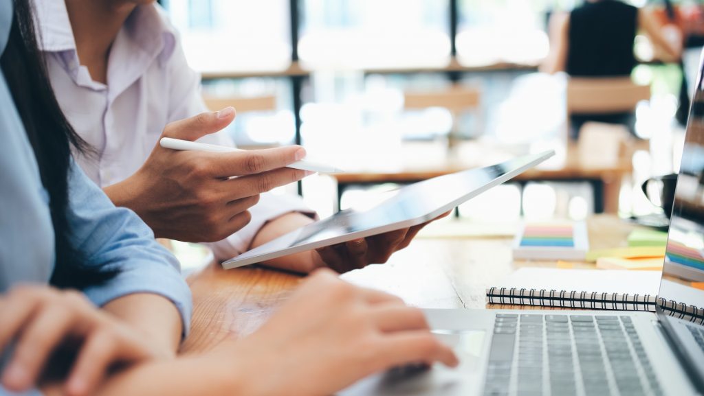 Business people With Digital Tablet In Office